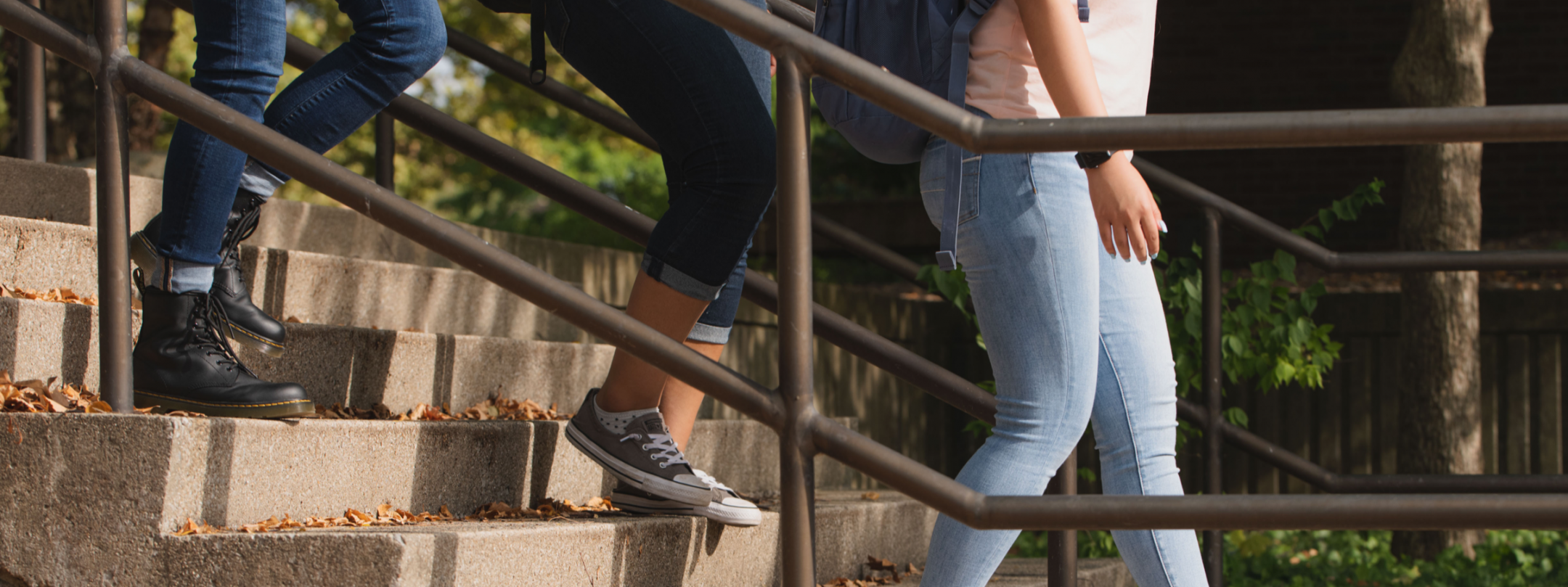 two people walking down stairs